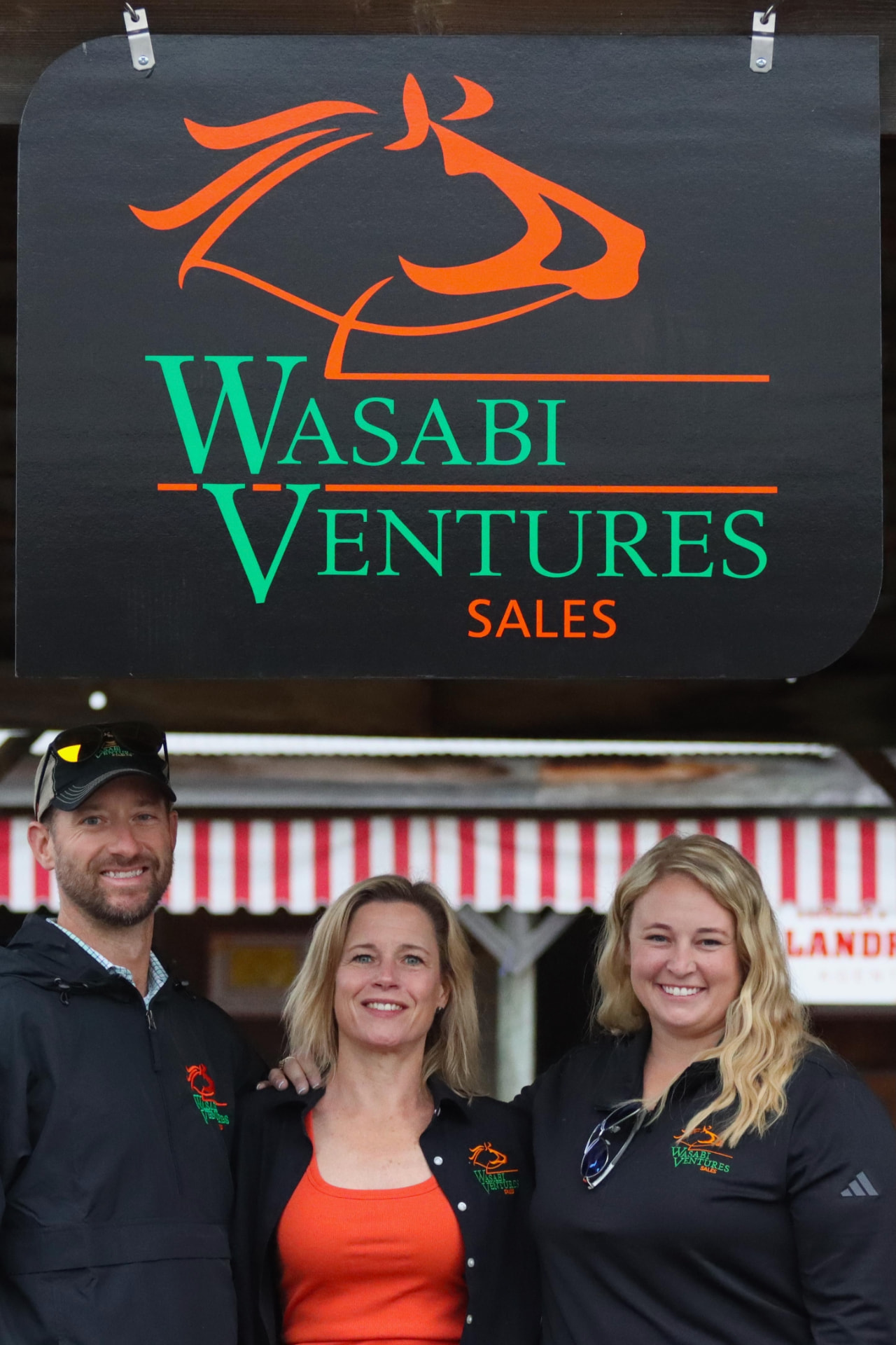 Wasabi Ventures Sales team under the barn sign at Fasig-Tipton Timonium